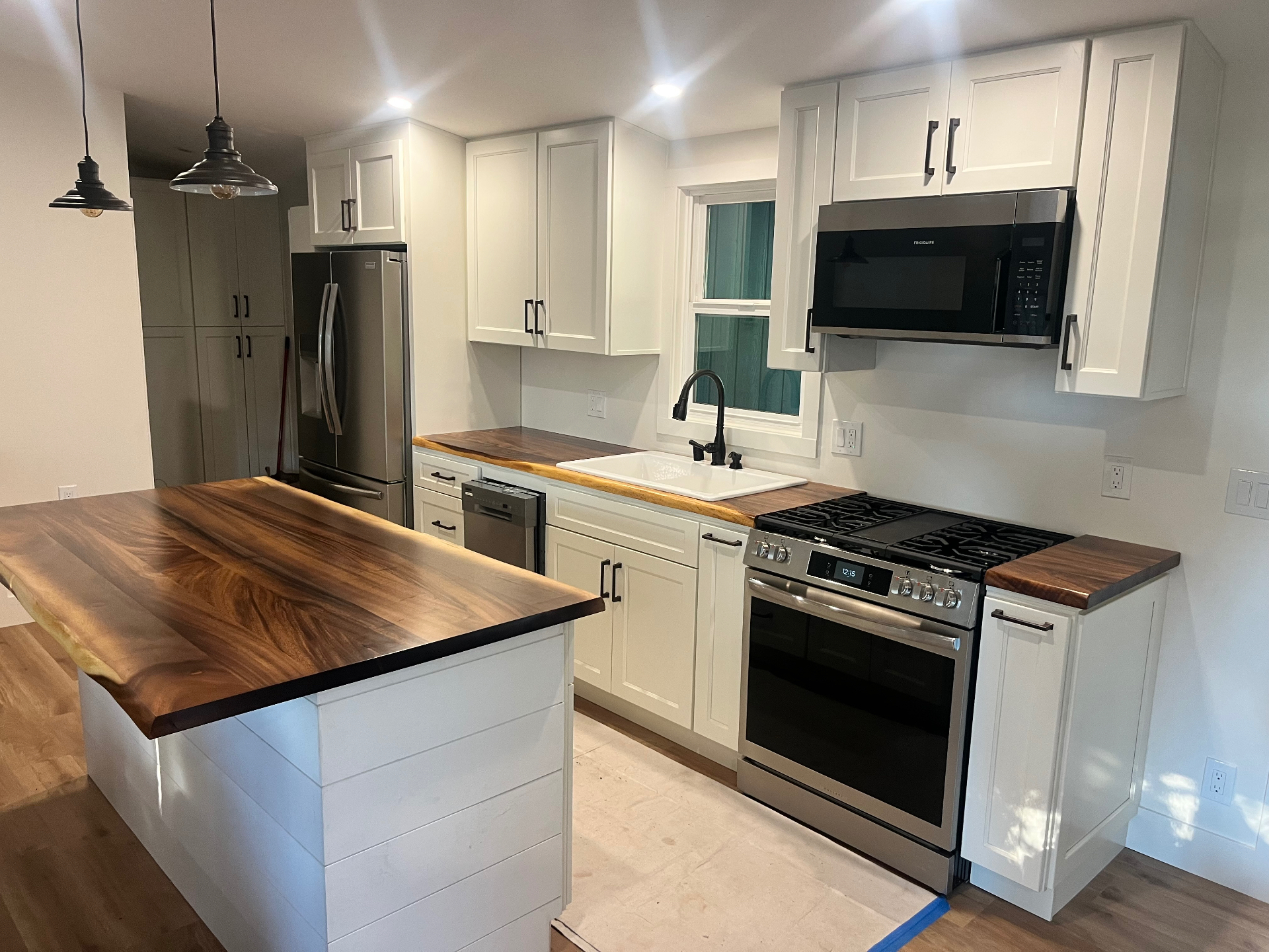 Custom kitchen remodel with live-edge walnut island built by MG Construction in Sonoma County